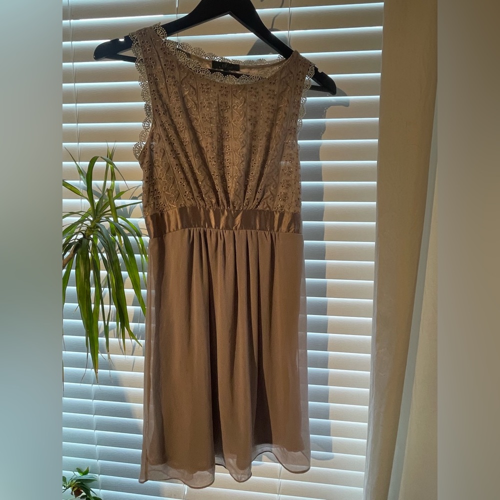 Beautiful dress with eyelet top, satin trim waist detail and chiffon bottom